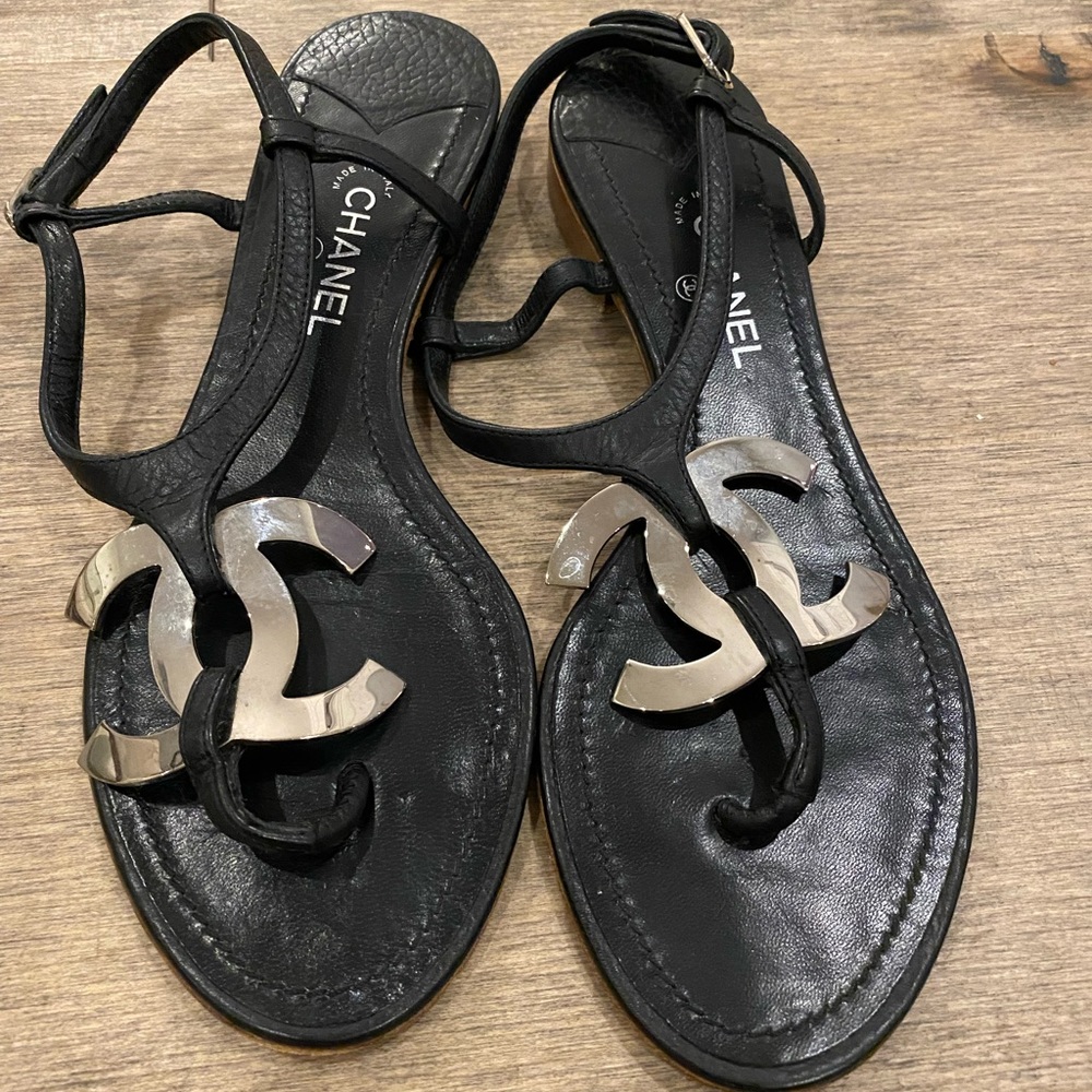 Authentic CHANEL black leather sandals with metal logo
